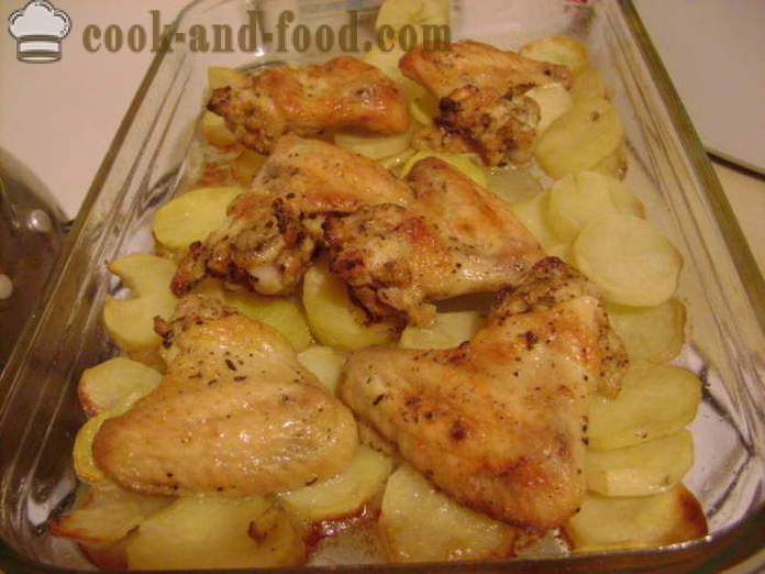 Kyllingvinger på en seng av potet i ovnen - hvordan å lage vinger og poteter i ovnen, med en trinnvis oppskrift bilder